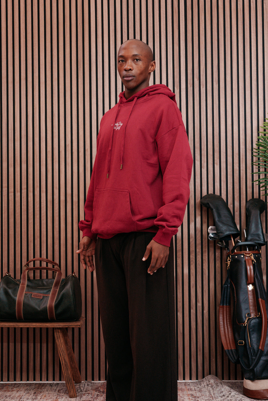 Burgundy hoodie worn three-quarter
