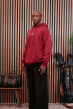 Burgundy hoodie worn three-quarter
